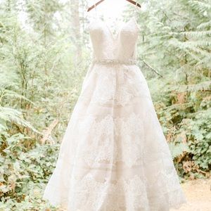 This is an allure 9400 in champagne and ivory. Size 22 with custom sash .